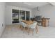 Outdoor kitchen and dining area with stone-clad grill, perfect for entertaining at 4779 Cragmere Loop, Clermont, FL 34711