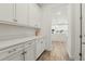 Walk-in pantry offering ample storage space with custom cabinets and countertops at 4779 Cragmere Loop, Clermont, FL 34711