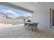 Covered patio with dining table overlooking a sparkling pool at 4779 Cragmere Loop, Clermont, FL 34711