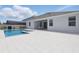 Beautiful pool and spa surrounded by an expansive patio area at 4779 Cragmere Loop, Clermont, FL 34711