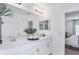Elegant bathroom with double vanity, decorative mirrors, and modern fixtures creating a spa-like ambiance at 4928 Bluebell Ct, Lake Hamilton, FL 33851