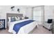 Stylish bedroom with a plush bed, patterned accents, and ample natural light from a window at 4928 Bluebell Ct, Lake Hamilton, FL 33851