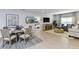 Inviting combined living area featuring a dining table and lounge area, creating a seamless and comfortable space at 4928 Bluebell Ct, Lake Hamilton, FL 33851