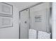 Modern shower with a glass enclosure and decorative wall art, creating a refreshing and stylish bathing space at 4928 Bluebell Ct, Lake Hamilton, FL 33851