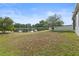 Large backyard featuring a pond and views of neighboring homes at 5108 Creekside Park Ave, Orlando, FL 32811
