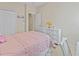 Comfortable bedroom featuring a metal bed frame, white dresser, and a well-lit space at 5108 Creekside Park Ave, Orlando, FL 32811