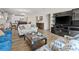 Stylish living room offering a seamless transition to the modern kitchen and dining area at 5108 Creekside Park Ave, Orlando, FL 32811
