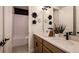 Modern bathroom with dual sinks, decorative accents, and a bathtub/shower combination at 536 Moon Shell Cir, New Smyrna Beach, FL 32168