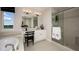 This contemporary bathroom boasts double sinks, a soaking tub, a glass-enclosed shower and sleek fixtures at 536 Moon Shell Cir, New Smyrna Beach, FL 32168