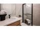 Compact bathroom features a tiled shower and vanity with modern fixtures at 536 Moon Shell Cir, New Smyrna Beach, FL 32168