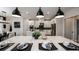 Gourmet kitchen with an island, pendant lighting, stainless appliances, and ample counter space at 536 Moon Shell Cir, New Smyrna Beach, FL 32168