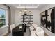 Stylish office space features a modern desk, decor, and comfortable chairs, ideal for a productive workspace at 536 Moon Shell Cir, New Smyrna Beach, FL 32168
