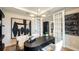 Well-appointed study features French doors and a modern chandelier at 536 Moon Shell Cir, New Smyrna Beach, FL 32168