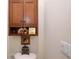 The bathroom has built-in storage over the toilet and traditional decor at 5510 Siracusa Ln, Sanford, FL 32771