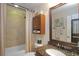 Full bathroom featuring a tiled shower, marble vanity, updated cabinet, and modern fixtures at 5510 Siracusa Ln, Sanford, FL 32771