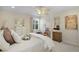 Comfortable bedroom with a four poster bed, neutral colors, ceiling fan, and carpeted floors at 5510 Siracusa Ln, Sanford, FL 32771