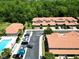 Aerial view of a well-planned community featuring manicured landscaping, ample parking, pool, and convenient access to amenities at 5510 Siracusa Ln, Sanford, FL 32771