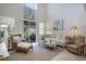 Light-filled living room is bright and airy with comfortable seating and access to the backyard at 5510 Siracusa Ln, Sanford, FL 32771