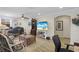 Inviting living room featuring wood floors, ceiling fan, and a tv for entertainment at 5510 Siracusa Ln, Sanford, FL 32771