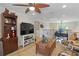 Cozy loft area with a ceiling fan, a workstation, and a comfortable seating area provides a relaxed, versatile space at 5510 Siracusa Ln, Sanford, FL 32771