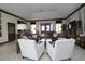 A contemporary lounge area showcases plush sofas, modern chairs, and an inviting atmosphere at 5510 Siracusa Ln, Sanford, FL 32771