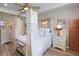 Cozy primary bedroom featuring wood-look floors, neutral colors, and elegant décor at 5510 Siracusa Ln, Sanford, FL 32771