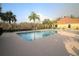 Community pool area with many lounge chairs and a sunny view at 5510 Siracusa Ln, Sanford, FL 32771
