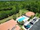 Aerial shot showcases the community pool, lush trees, and manicured landscaping, offering residents a relaxing outdoor oasis at 5510 Siracusa Ln, Sanford, FL 32771