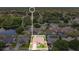 Bird's eye view of the neighborhood showcasing the home, community, and nearby lake at 5836 Goldenwood Dr, Orlando, FL 32817
