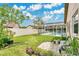 Backyard with pool view, privacy fence, and lush landscaping at 5836 Goldenwood Dr, Orlando, FL 32817