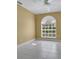 Bedroom featuring large window, ceiling fan, and neutral color scheme at 5836 Goldenwood Dr, Orlando, FL 32817