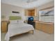 Bedroom featuring built-in shelving, desk, and ample natural light at 5836 Goldenwood Dr, Orlando, FL 32817