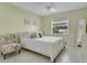 Bright bedroom featuring a queen bed, floral chair, and ample natural light at 5836 Goldenwood Dr, Orlando, FL 32817