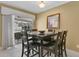 Cozy dining room with a view of the pool, perfect for Gathering meals at 5836 Goldenwood Dr, Orlando, FL 32817