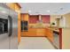 Modern kitchen featuring stainless steel appliances, granite countertops, and updated cabinetry at 5836 Goldenwood Dr, Orlando, FL 32817