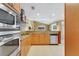 Bright kitchen features stainless appliances, granite countertops, and ample cabinet space at 5836 Goldenwood Dr, Orlando, FL 32817