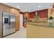 Well-equipped kitchen with stainless steel appliances, granite countertops, and ample cabinet space at 5836 Goldenwood Dr, Orlando, FL 32817