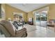 Comfortable living room with sliding doors to the pool area and plenty of natural light at 5836 Goldenwood Dr, Orlando, FL 32817