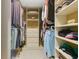 Walk-in closet with custom shelving providing lots of storage space at 5836 Goldenwood Dr, Orlando, FL 32817