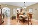 Open-concept dining area featuring seamless access to the front door and kitchen at 600 N Boundary Avenue # 119A, Deland, FL 32720