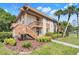 Condo featuring a neatly kept lawn, verdant trees, and a serene setting at 600 N Boundary Avenue # 119A, Deland, FL 32720