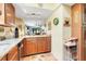 Charming kitchen featuring granite countertops and stylish sunflower accents at 600 N Boundary Avenue # 119A, Deland, FL 32720
