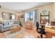 Cozy living area featuring comfortable seating, a large window, and a charming workspace at 600 N Boundary Avenue # 119A, Deland, FL 32720