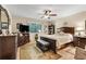 Spacious main bedroom featuring a dark wood bed frame and decorative accents at 600 N Boundary Avenue # 119A, Deland, FL 32720