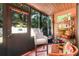 Cozy screened porch featuring stylish decor and outdoor views at 600 N Boundary Avenue # 119A, Deland, FL 32720