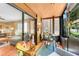 Inviting screened porch with natural light and comfortable seating at 600 N Boundary Avenue # 119A, Deland, FL 32720