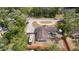 Aerial view of a well-maintained property with a long driveway and solar panels at 617 E Citrus St, Altamonte Springs, FL 32701