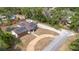 Aerial view of home featuring brick exterior, solar panels, and large driveway at 617 E Citrus St, Altamonte Springs, FL 32701