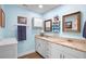 Bright bathroom with double vanity, granite countertop, and modern fixtures at 617 E Citrus St, Altamonte Springs, FL 32701