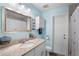 Bright bathroom featuring a single vanity, granite countertops, and storage cabinet at 617 E Citrus St, Altamonte Springs, FL 32701